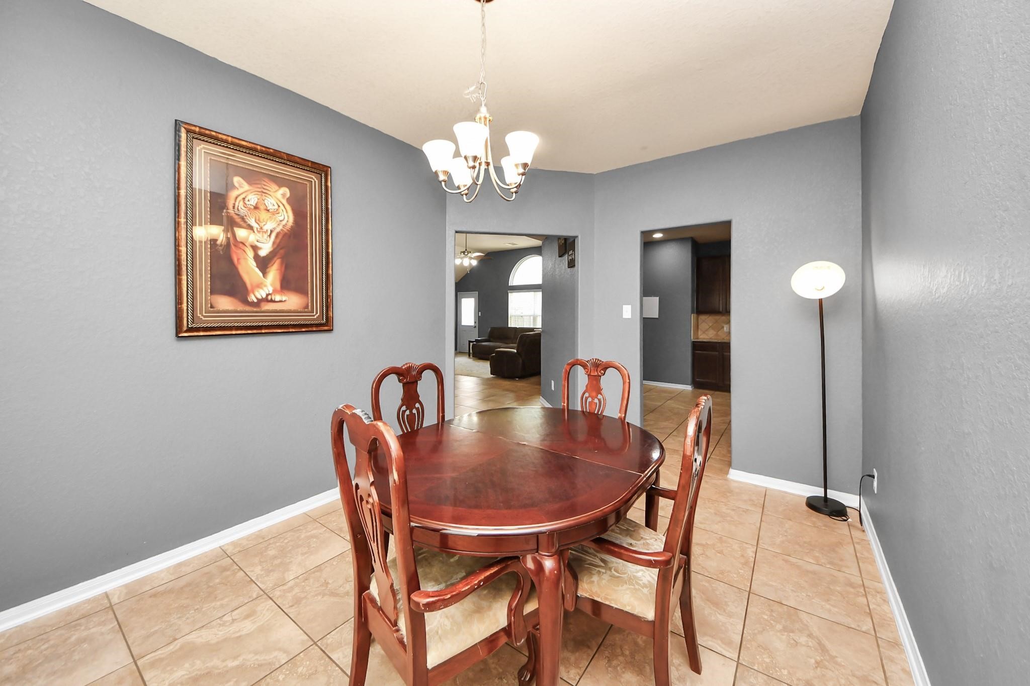 15003 Signal Ridge Way Cypress, TX 77429 - Photo 18 of 40 a dining room with furniture and chandelier