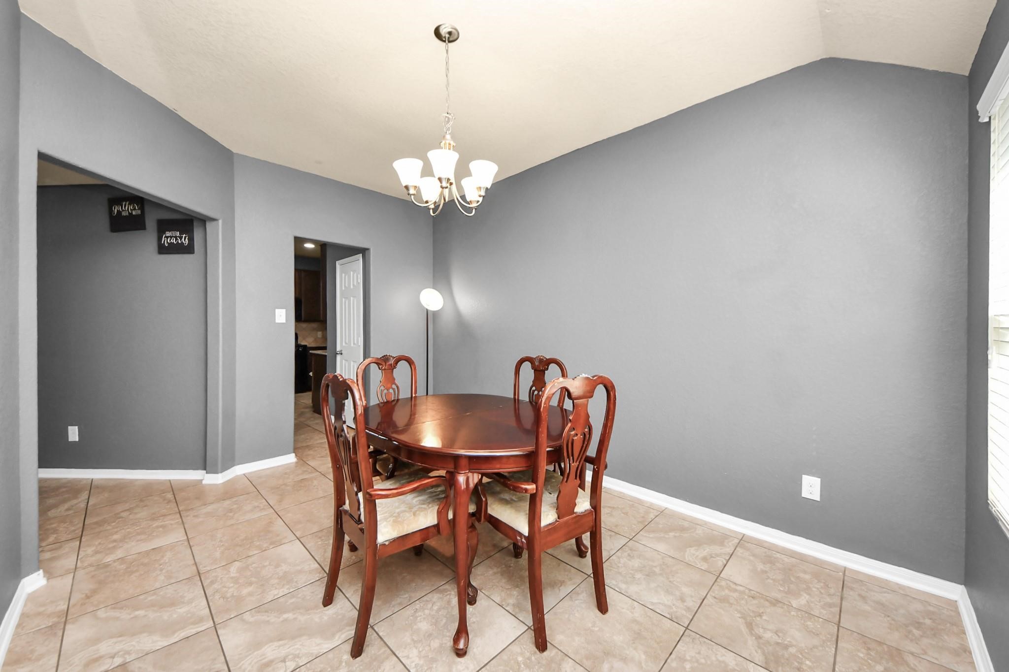15003 Signal Ridge Way Cypress, TX 77429 - Photo 19 of 40 a dining room with furniture and chandelier