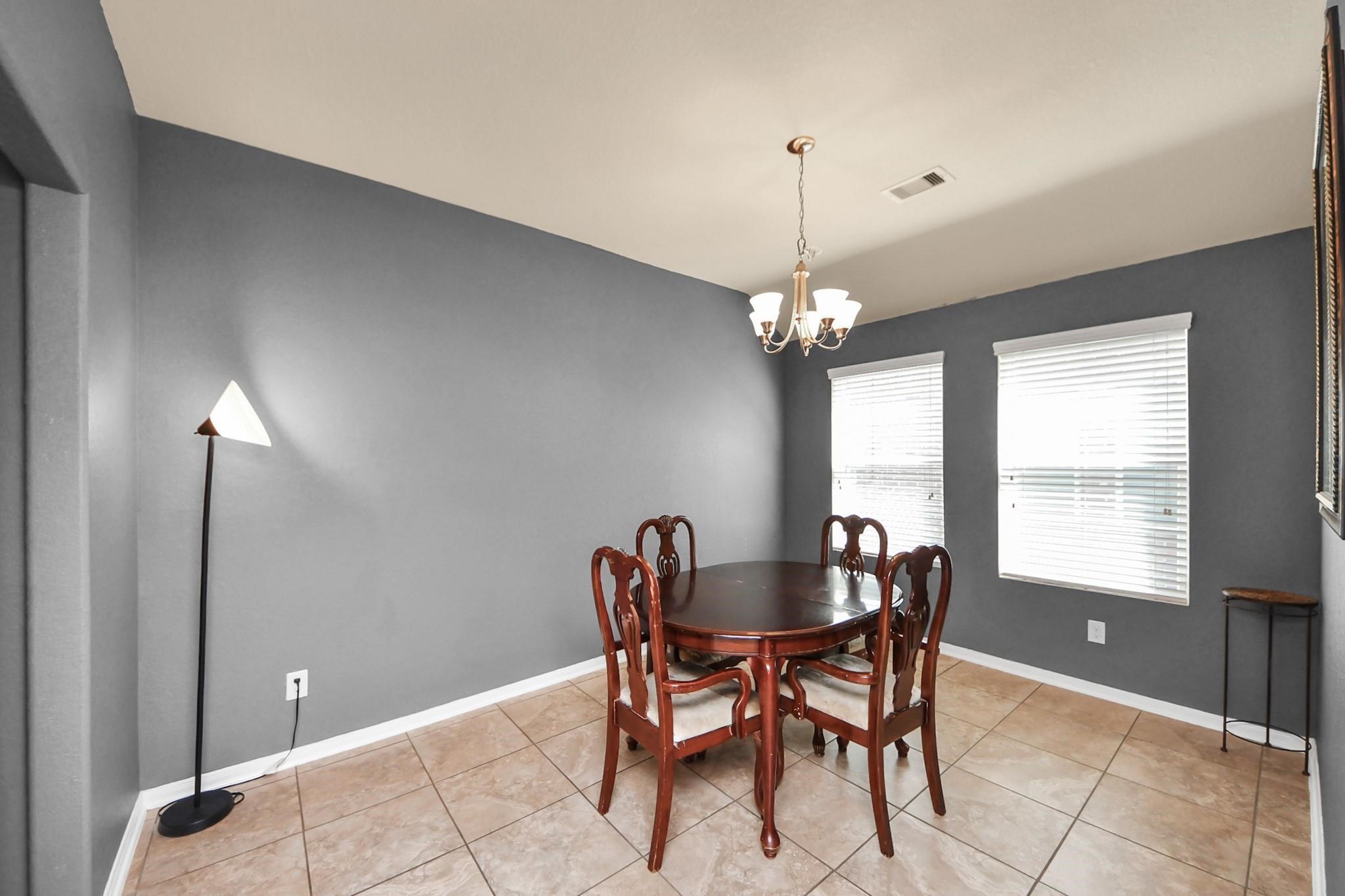 15003 Signal Ridge Way Cypress, TX 77429 - Photo 20 of 40 a dining room with furniture and window