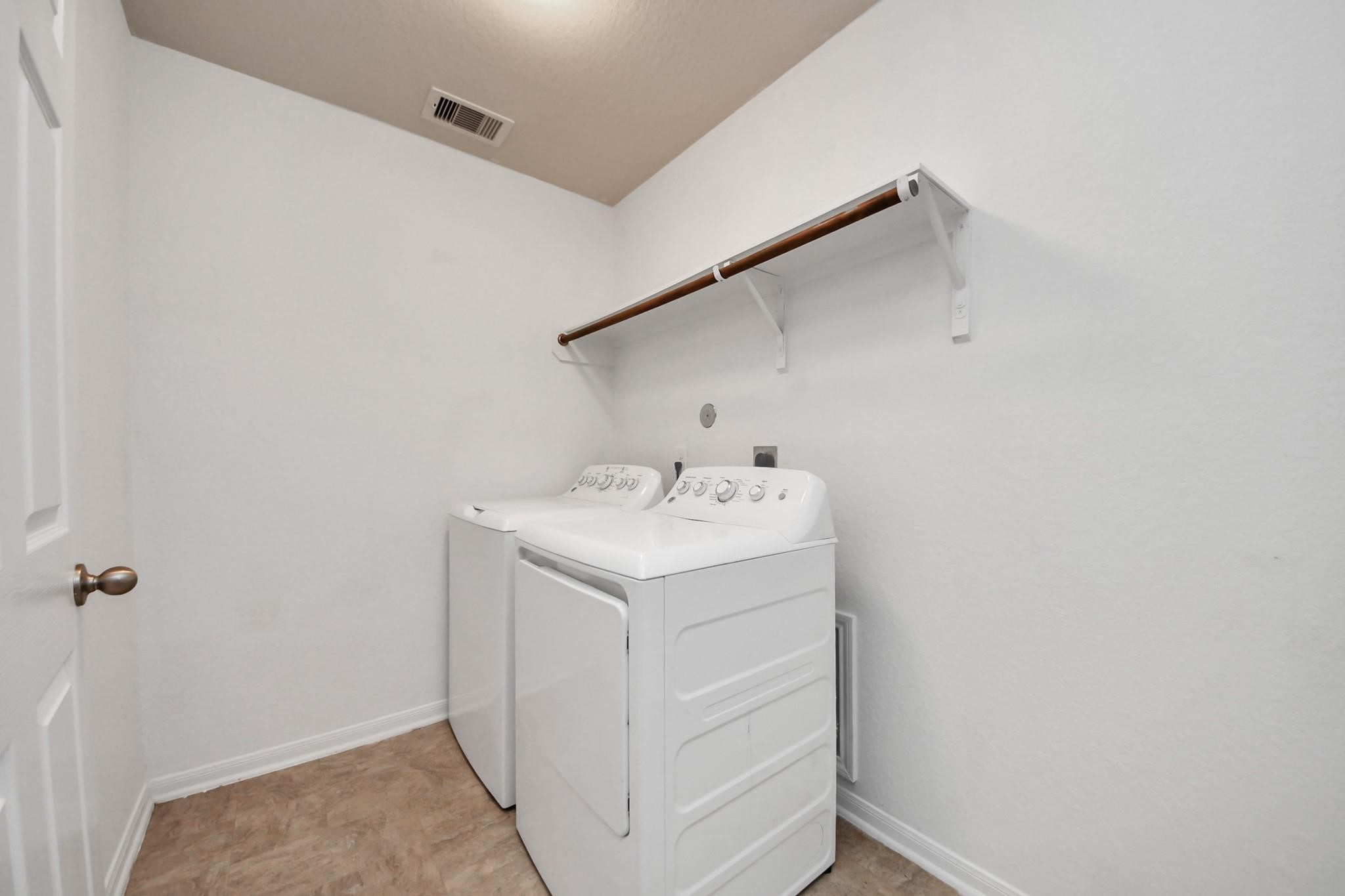 15003 Signal Ridge Way Cypress, TX 77429 - Photo 21 of 40 a utility room with dryer and washer