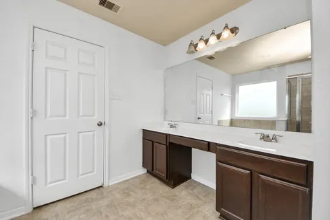 a utility room with cabinets