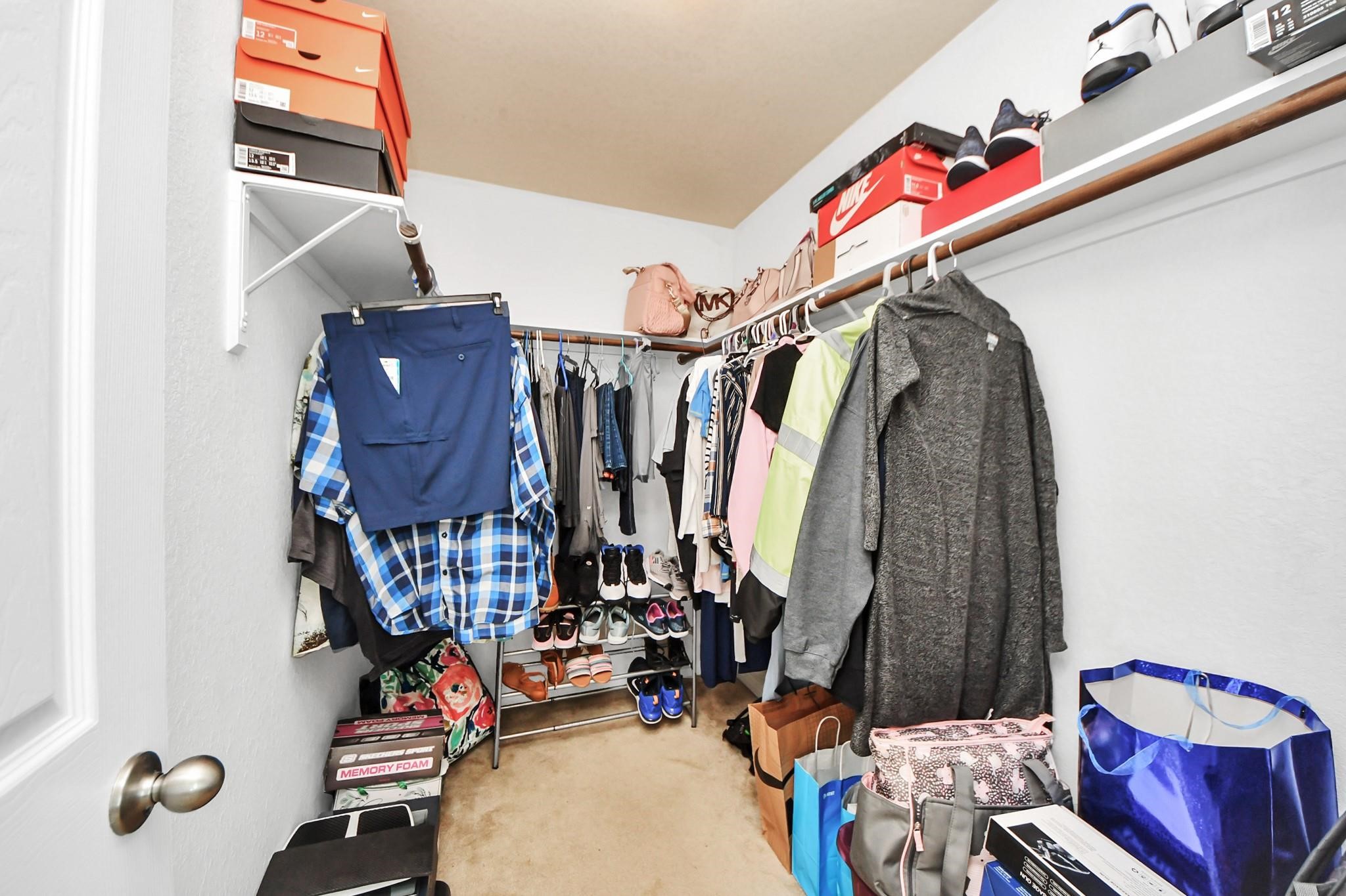 15003 Signal Ridge Way Cypress, TX 77429 - Photo 28 of 40 a view of walk in closet with clothes and shoes