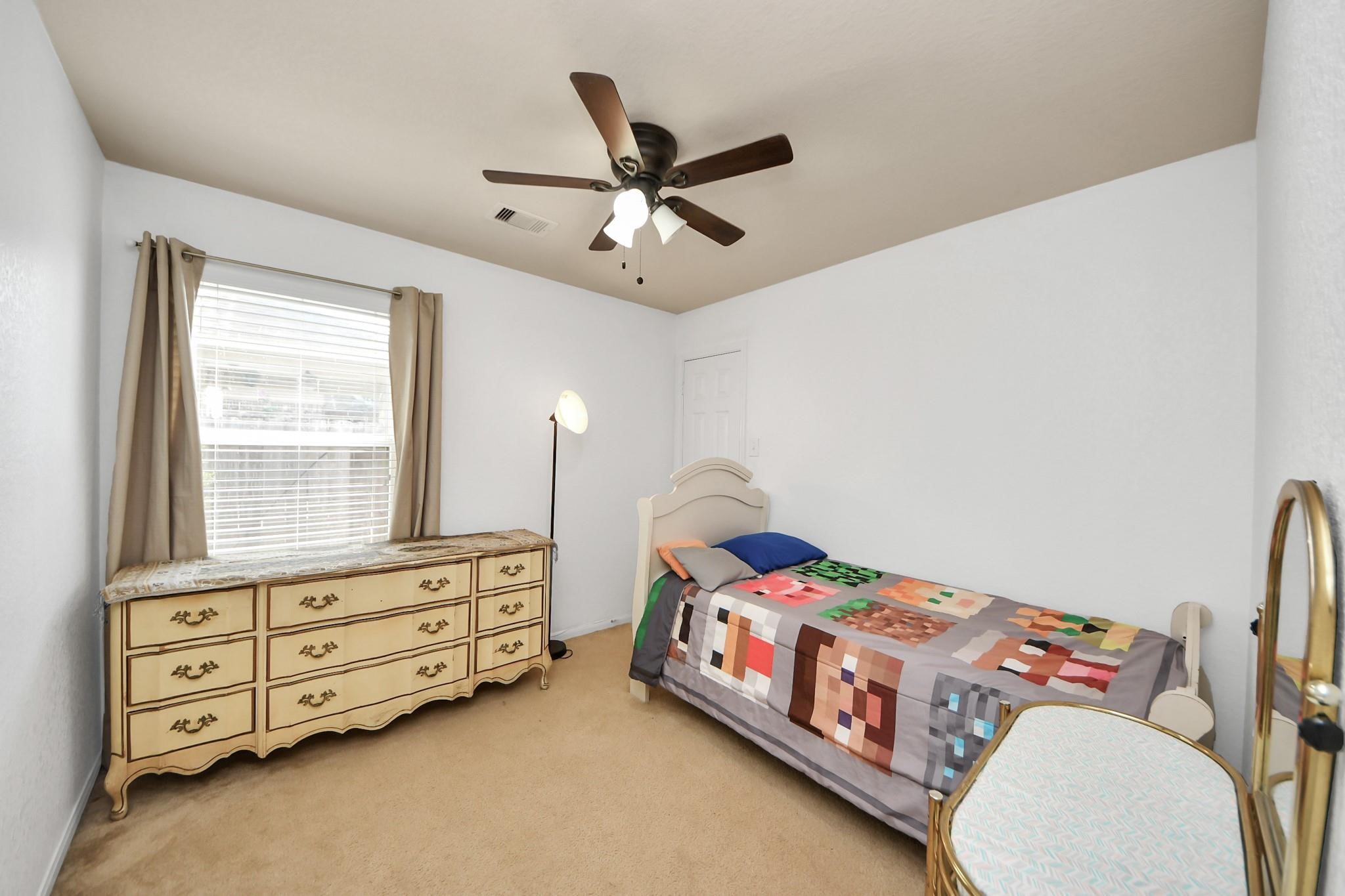 15003 Signal Ridge Way Cypress, TX 77429 - Photo 30 of 40 a bedroom with a bed and a tv