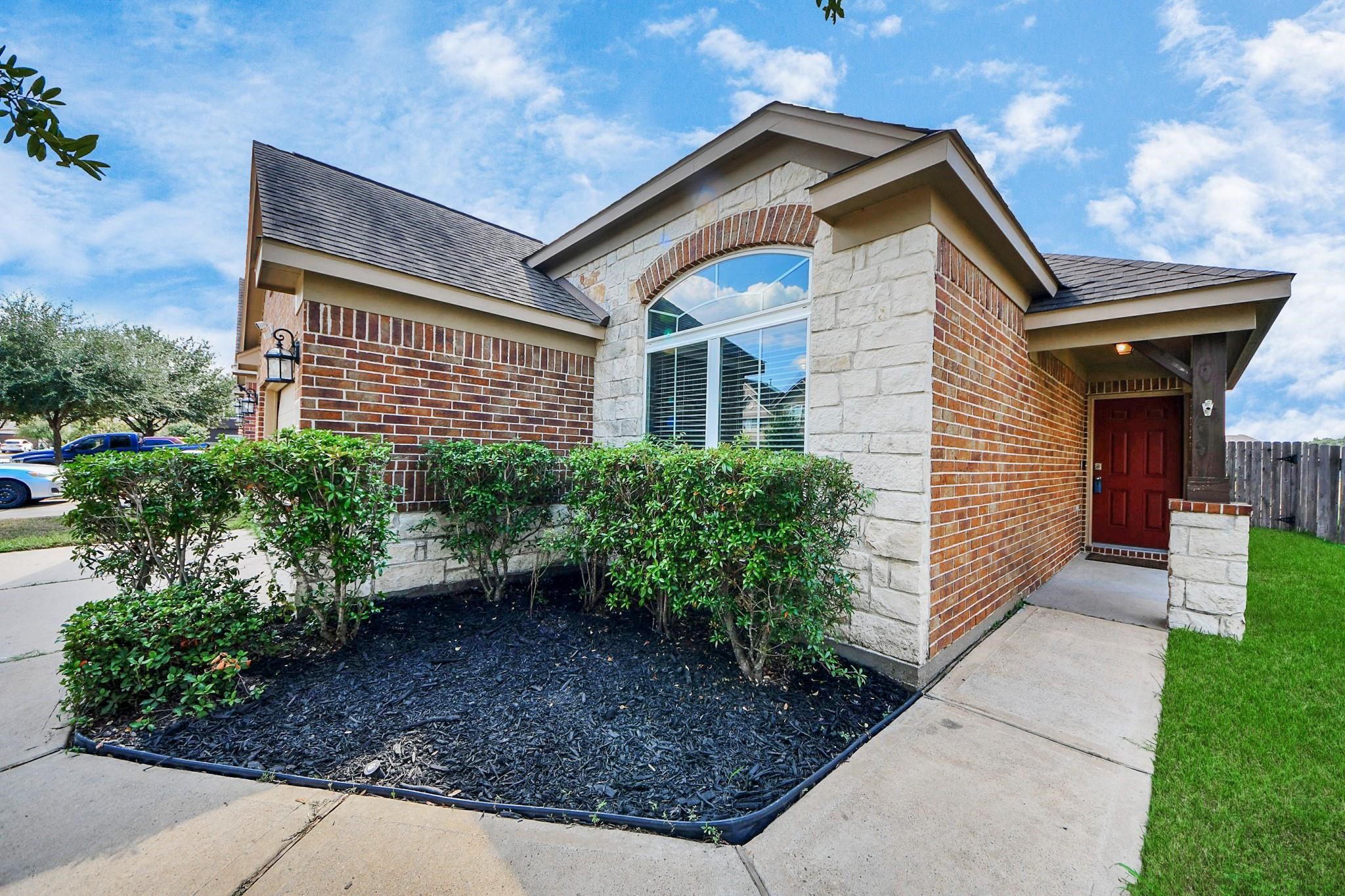 15003 Signal Ridge Way Cypress, TX 77429 - Photo 4 of 40 a front view of a house with garden