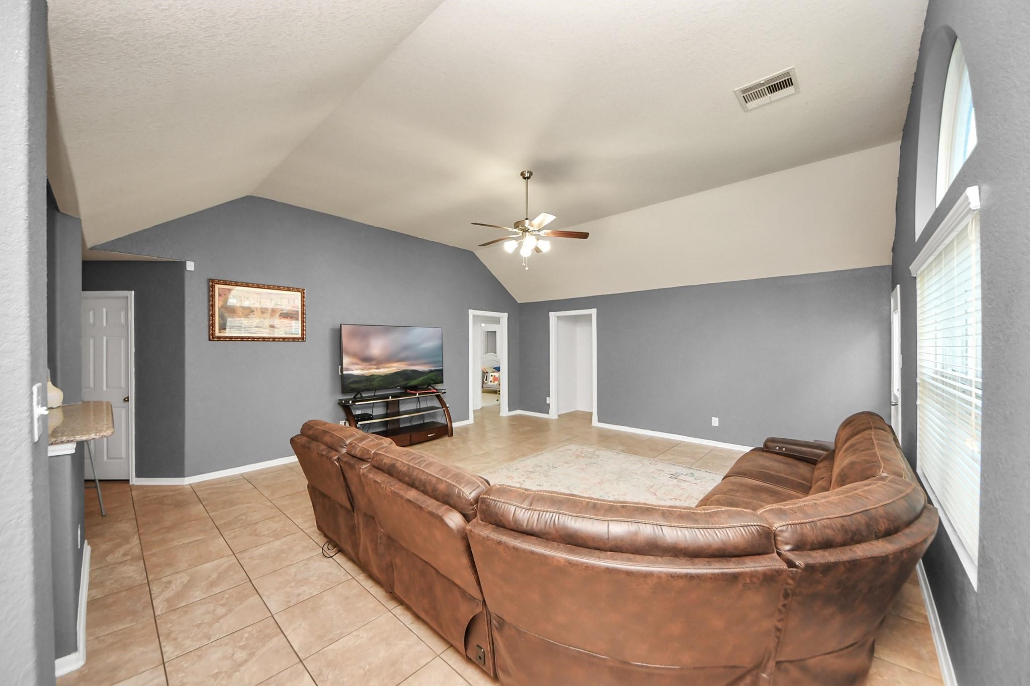 15003 Signal Ridge Way Cypress, TX 77429 - Photo 7 of 40 a living room with furniture and a chandelier