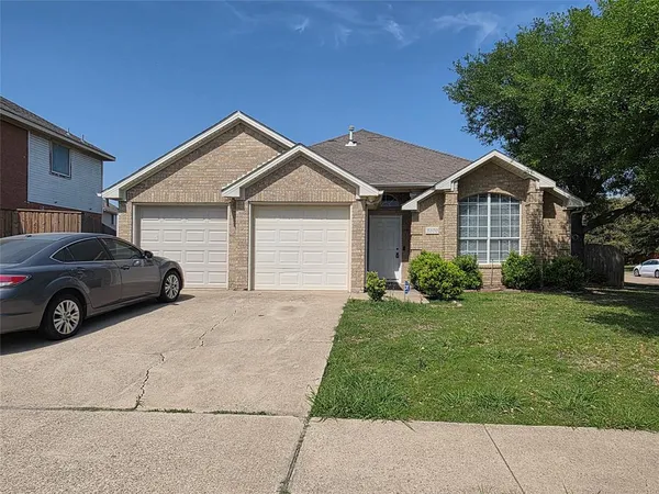 a house view with a garden space