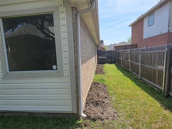 a view of backyard with green space