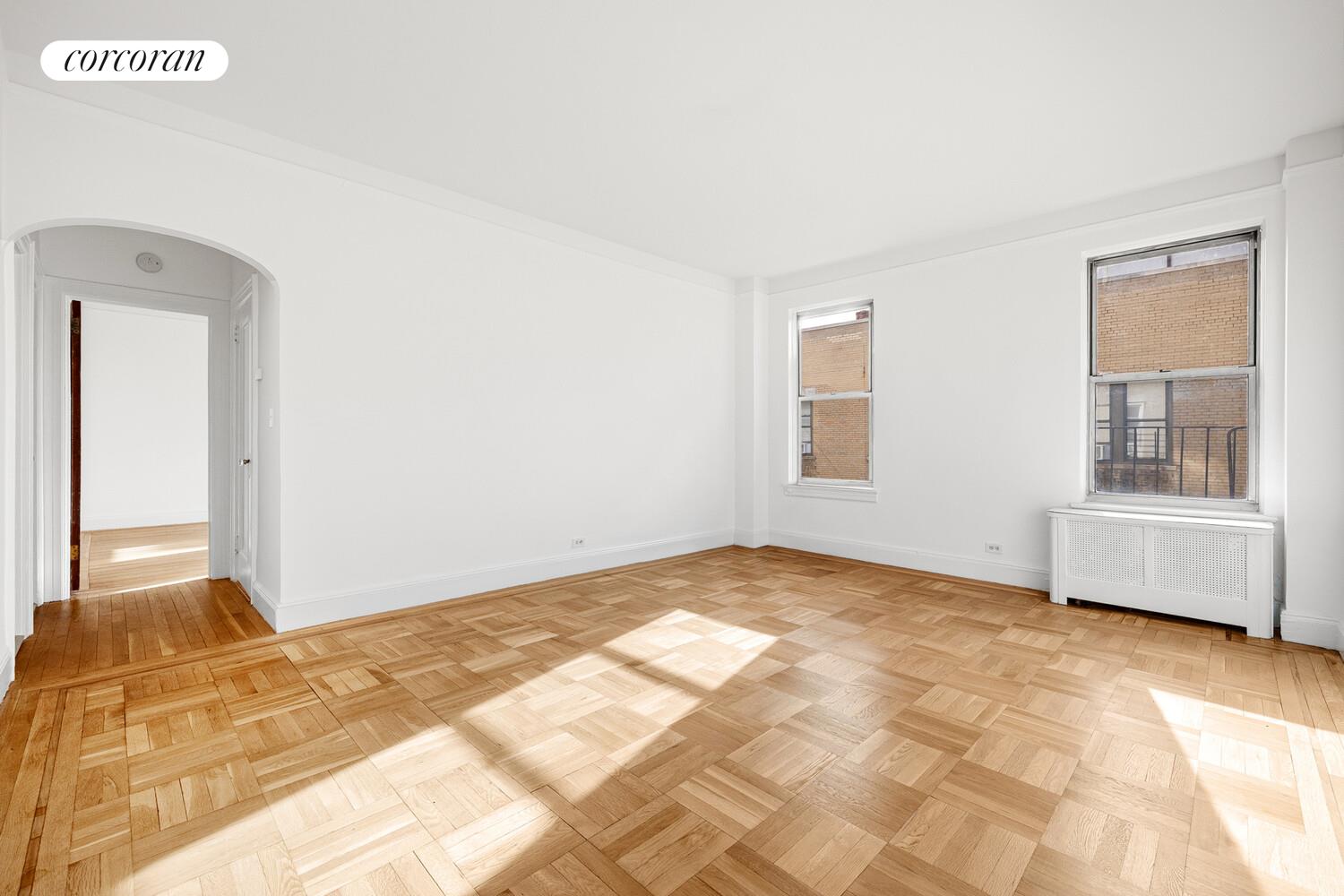 318 West 100th Street, Unit 7D Manhattan, NY 10025 - Photo 4 of 17 a view of an empty room and window