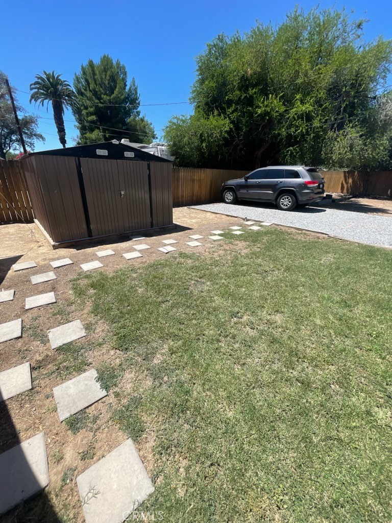 3857 Pine Street Riverside, CA 92501 - Photo 5 of 8 a view of a backyard with wooden fence