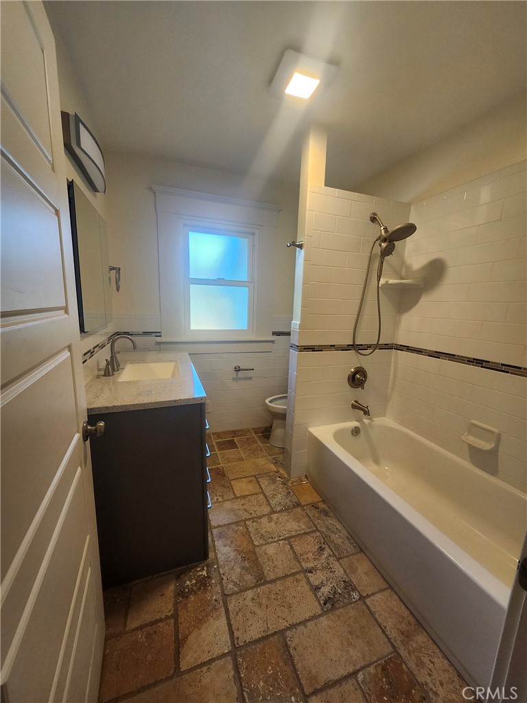 3857 Pine Street Riverside, CA 92501 - Photo 6 of 8 a utility room with a washer and dryer