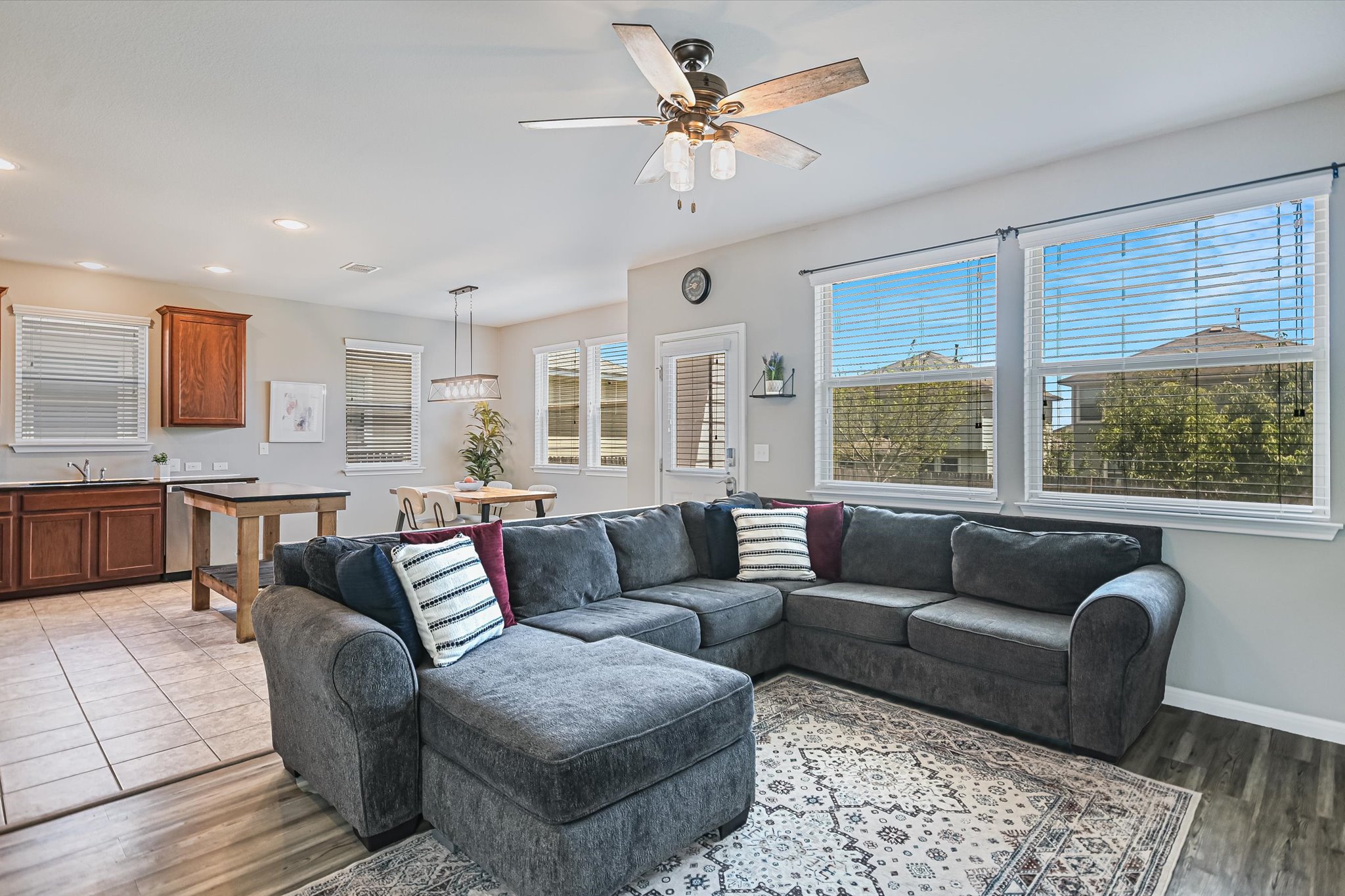 225 Vestral Road Buda, TX 78610 - Photo 4 of 24 The living room is the heart of the main level providing a comfortable gathering space for everyday living, movie nights, time with family and friends. Whether the evening calls for takeout or friends gathering, this is where life happens.