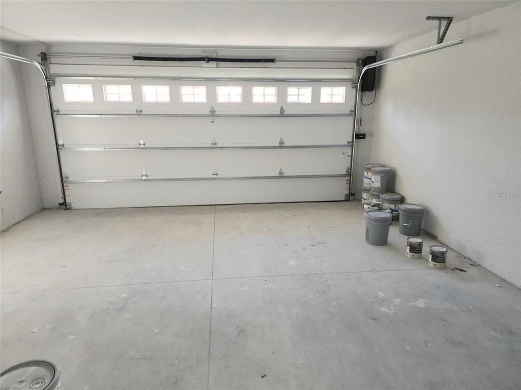 1111 Dagmar Avenue Spring Hill, FL 34606 - Photo 12 of 27 a room with a bench