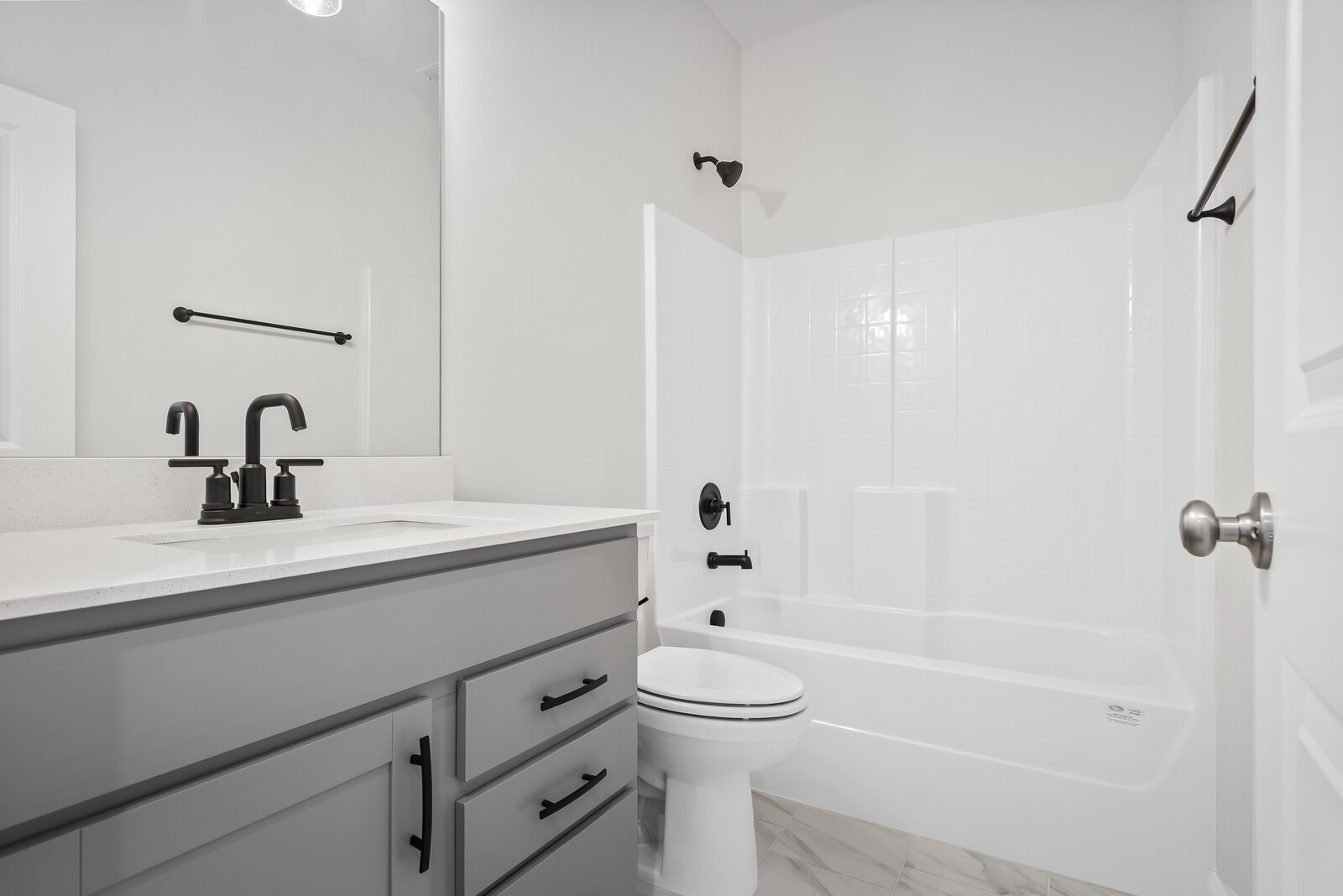 7108 Comstock Road Spring Hill, TN 37174 - Photo 14 of 70 a bathroom with a sink a toilet and shower