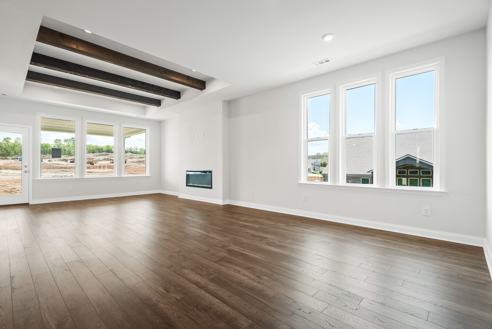 7108 Comstock Road Spring Hill, TN 37174 - Photo 18 of 70 an empty room with wooden floor and windows