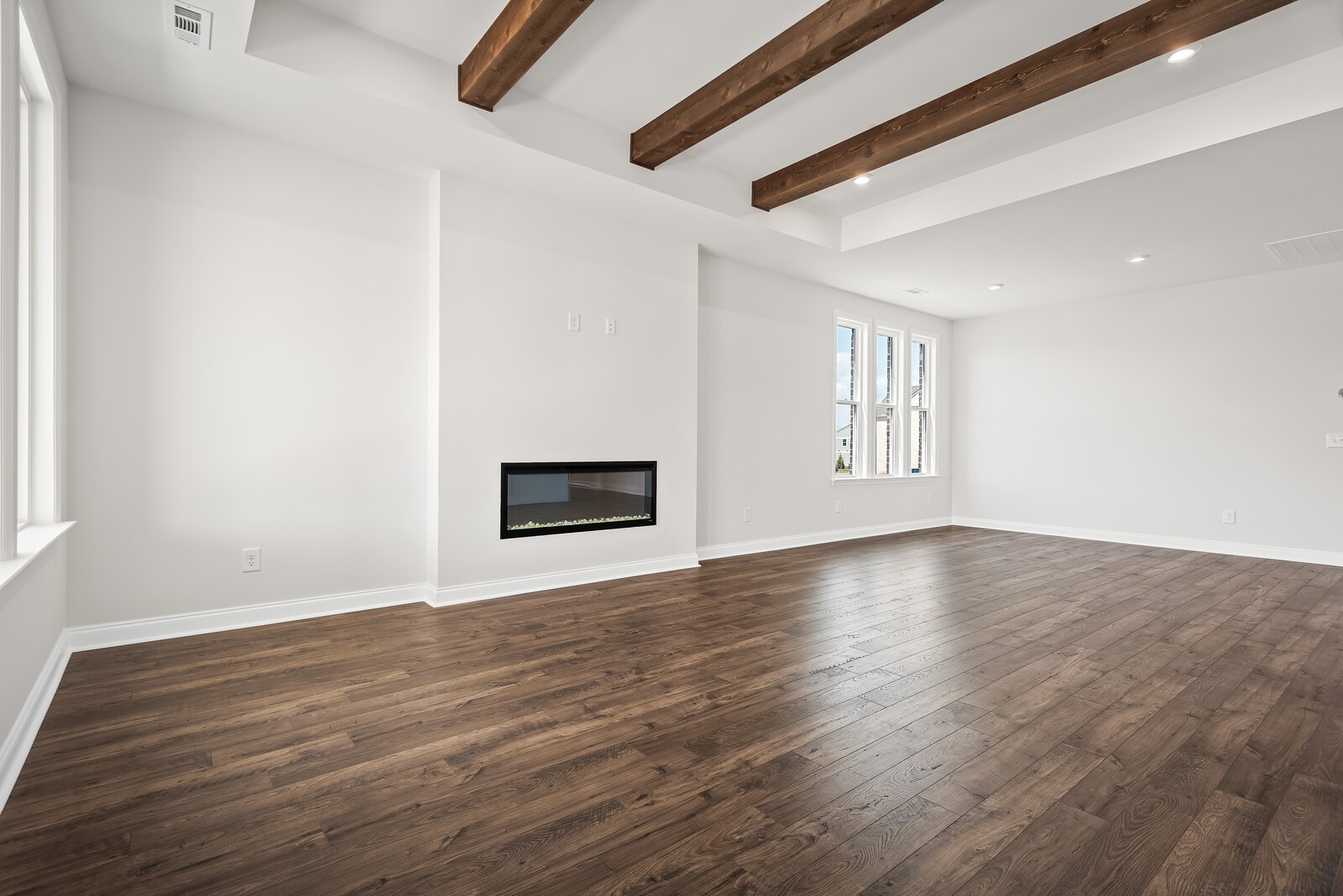 7108 Comstock Road Spring Hill, TN 37174 - Photo 23 of 70 a view of an empty room with wooden floor and a window
