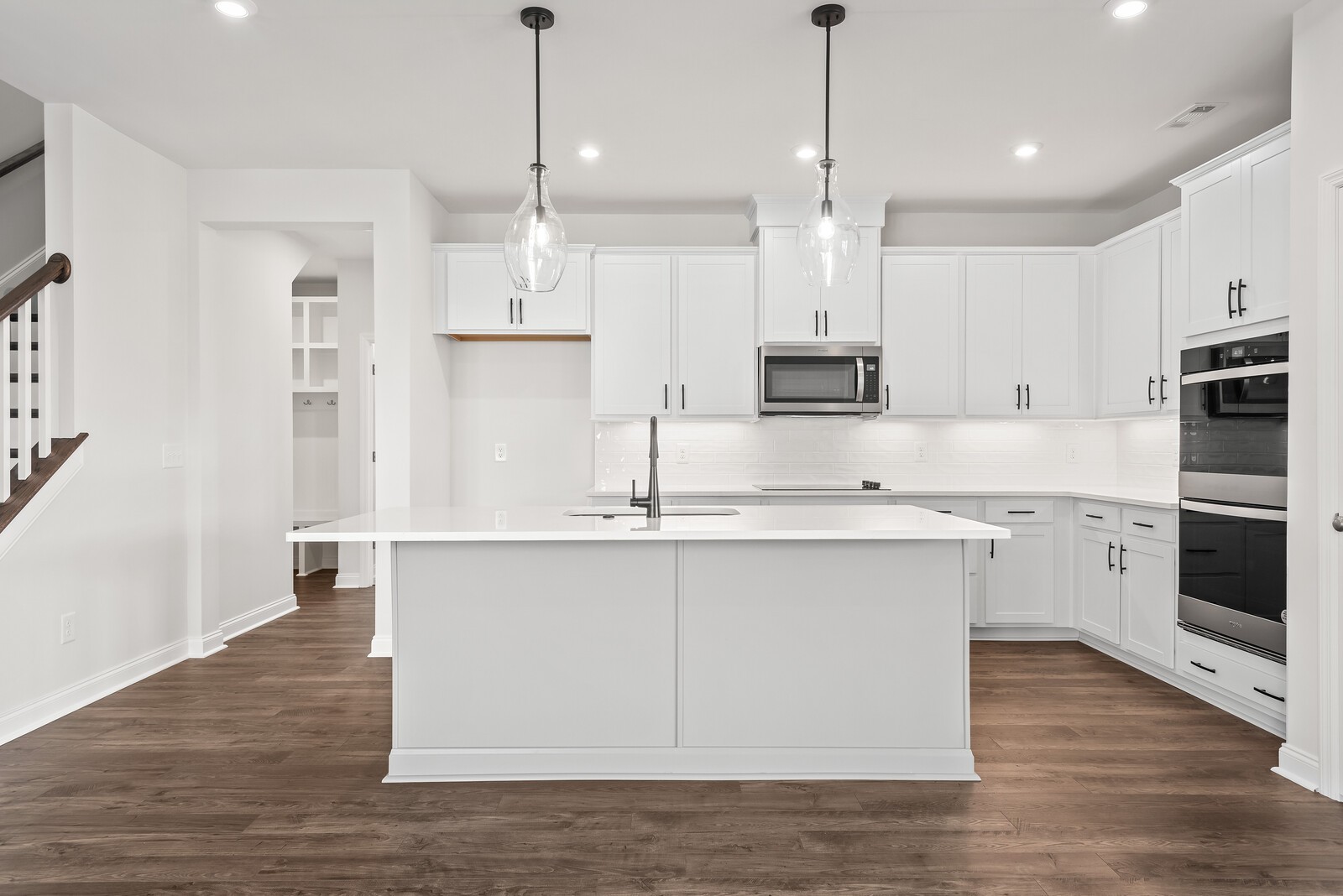 7108 Comstock Road Spring Hill, TN 37174 - Photo 26 of 70 a kitchen with stainless steel appliances granite countertop a sink a stove a refrigerator and white cabinets