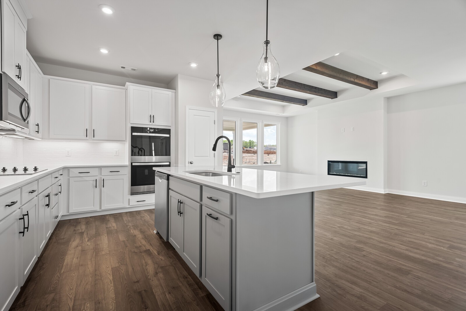 7108 Comstock Road Spring Hill, TN 37174 - Photo 28 of 70 a kitchen with stainless steel appliances granite countertop a sink a stove and a refrigerator