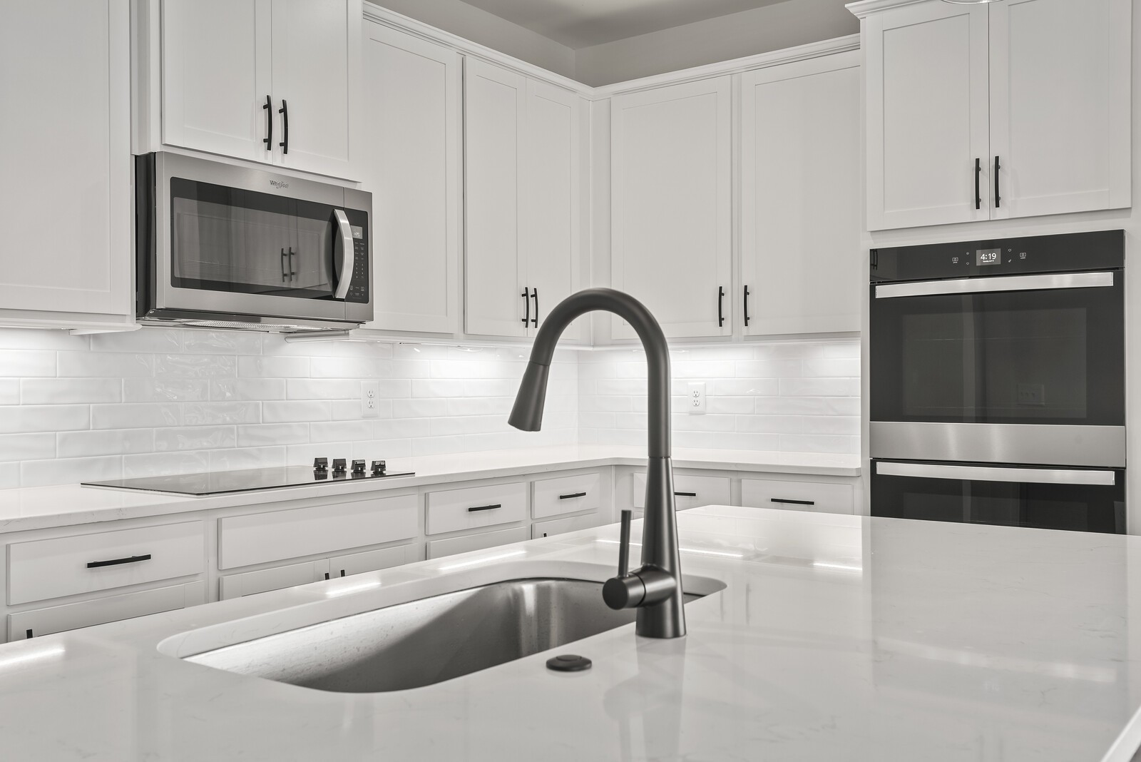 7108 Comstock Road Spring Hill, TN 37174 - Photo 30 of 70 a kitchen with sink a microwave and stove