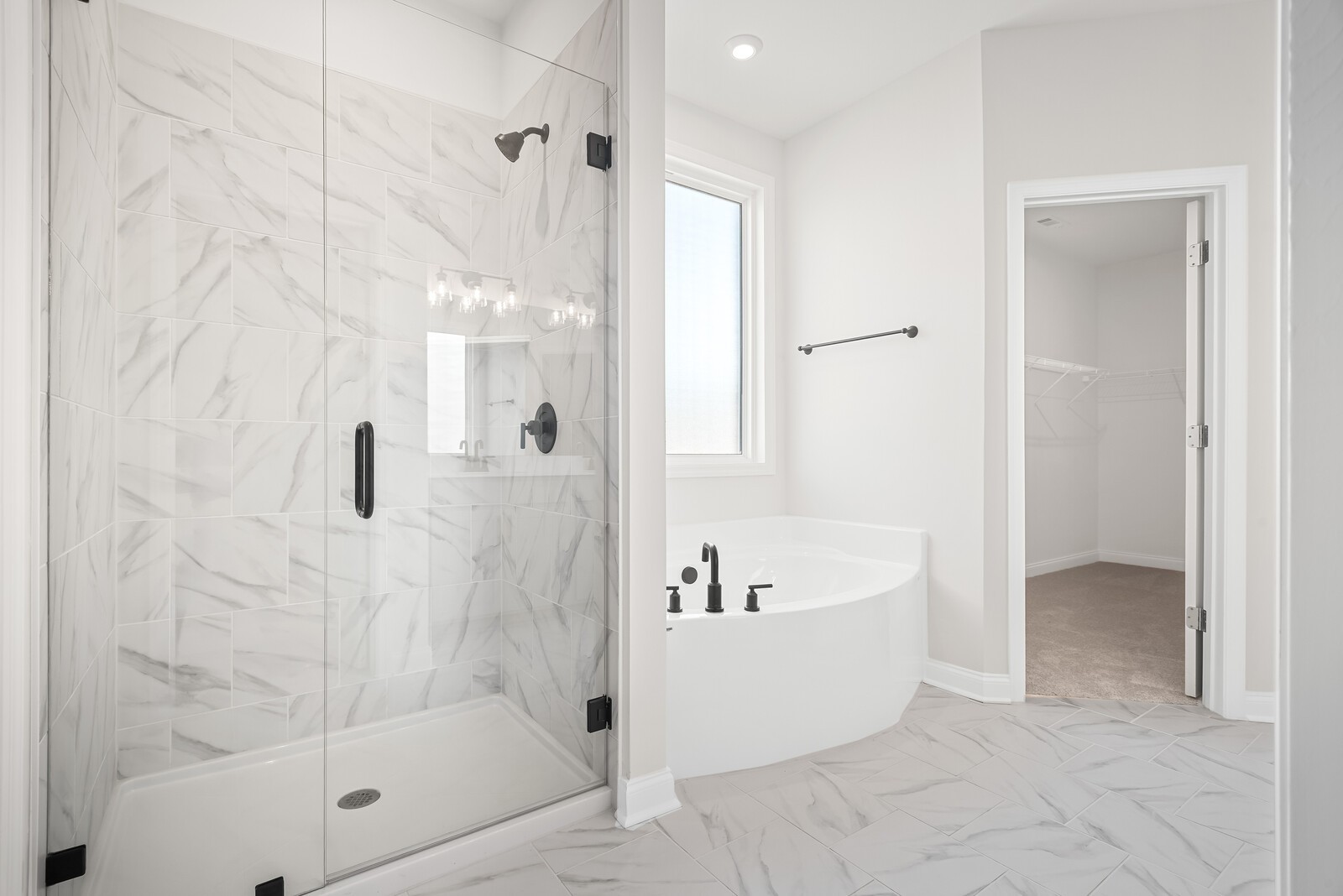 7108 Comstock Road Spring Hill, TN 37174 - Photo 38 of 70 a bathroom with a bathtub and shower