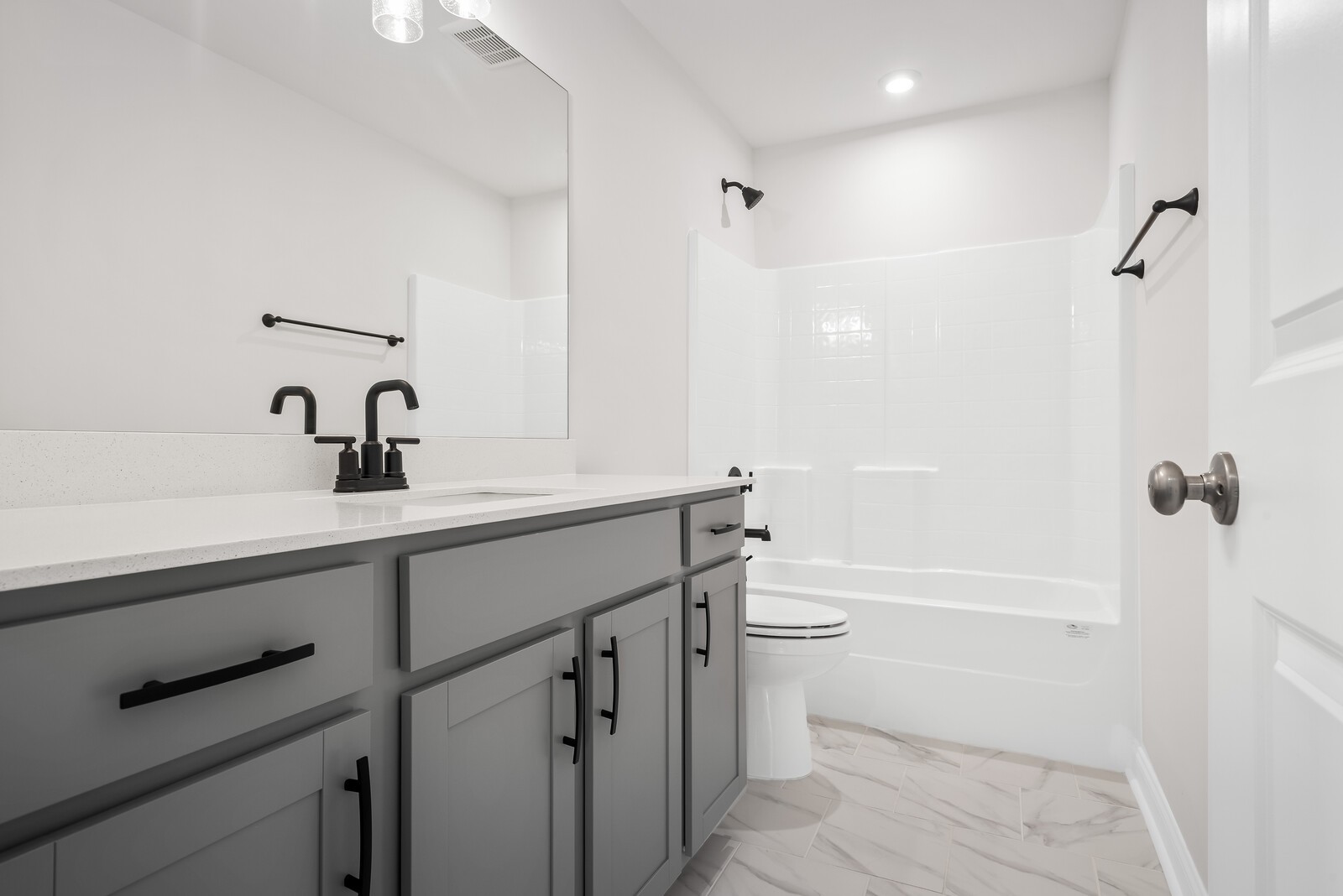 7108 Comstock Road Spring Hill, TN 37174 - Photo 46 of 70 a bathroom with a sink a toilet and shower