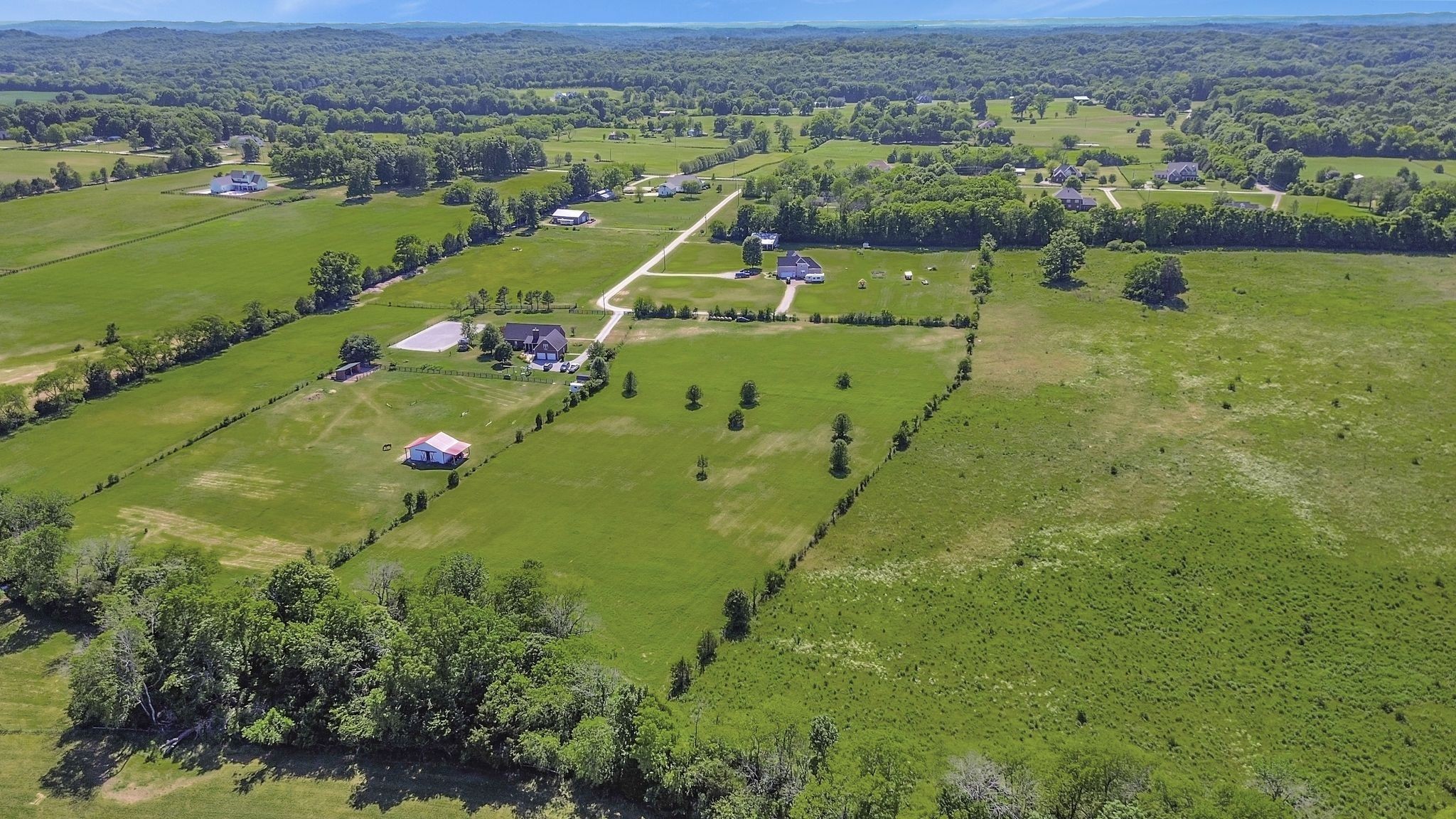 7108 Comstock Road Spring Hill, TN 37174 - Photo 63 of 70 an aerial view of a houses with a lake