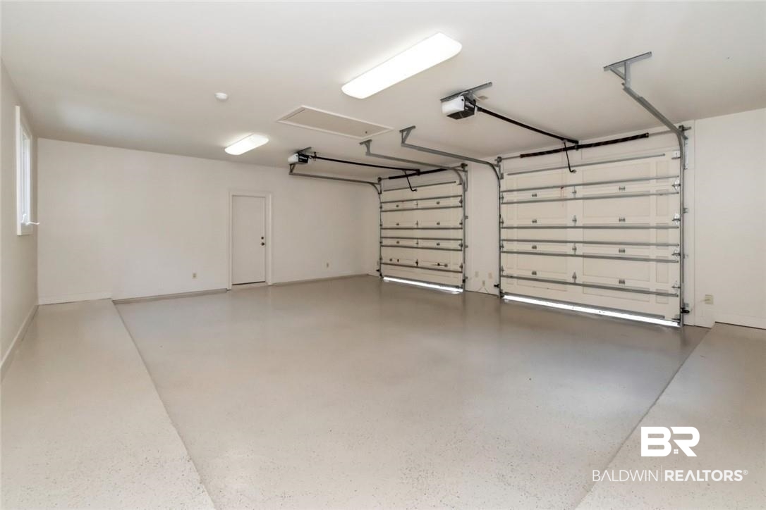4 Chancery Court Mobile, AL 36608 - Photo 42 of 54 Garage featuring a garage door opener