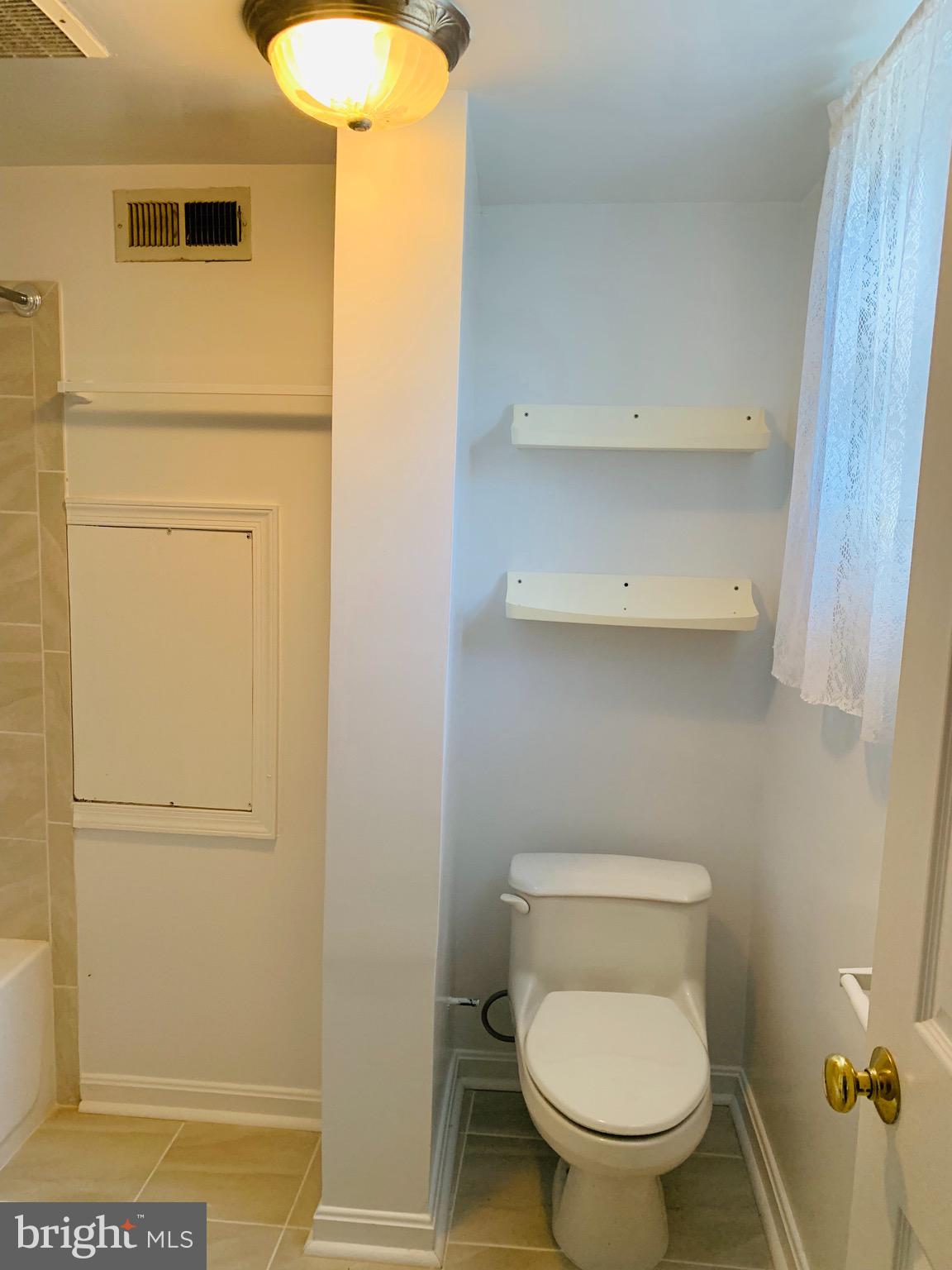 5902 Flanders Street Springfield, VA 22150 - Photo 35 of 45 Lower level hallway bathroom.