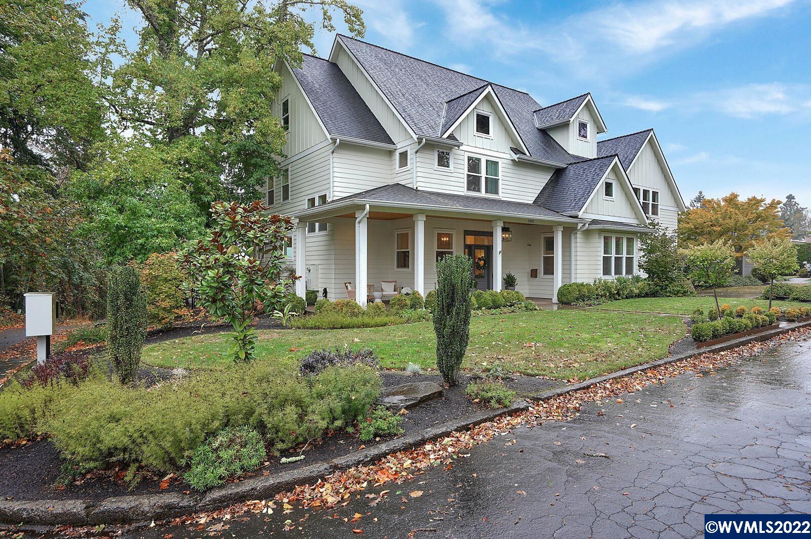 1895 Rio Vista Way South Salem, OR 97302 - Photo 3 of 42 a front view of a house with a garden and plants