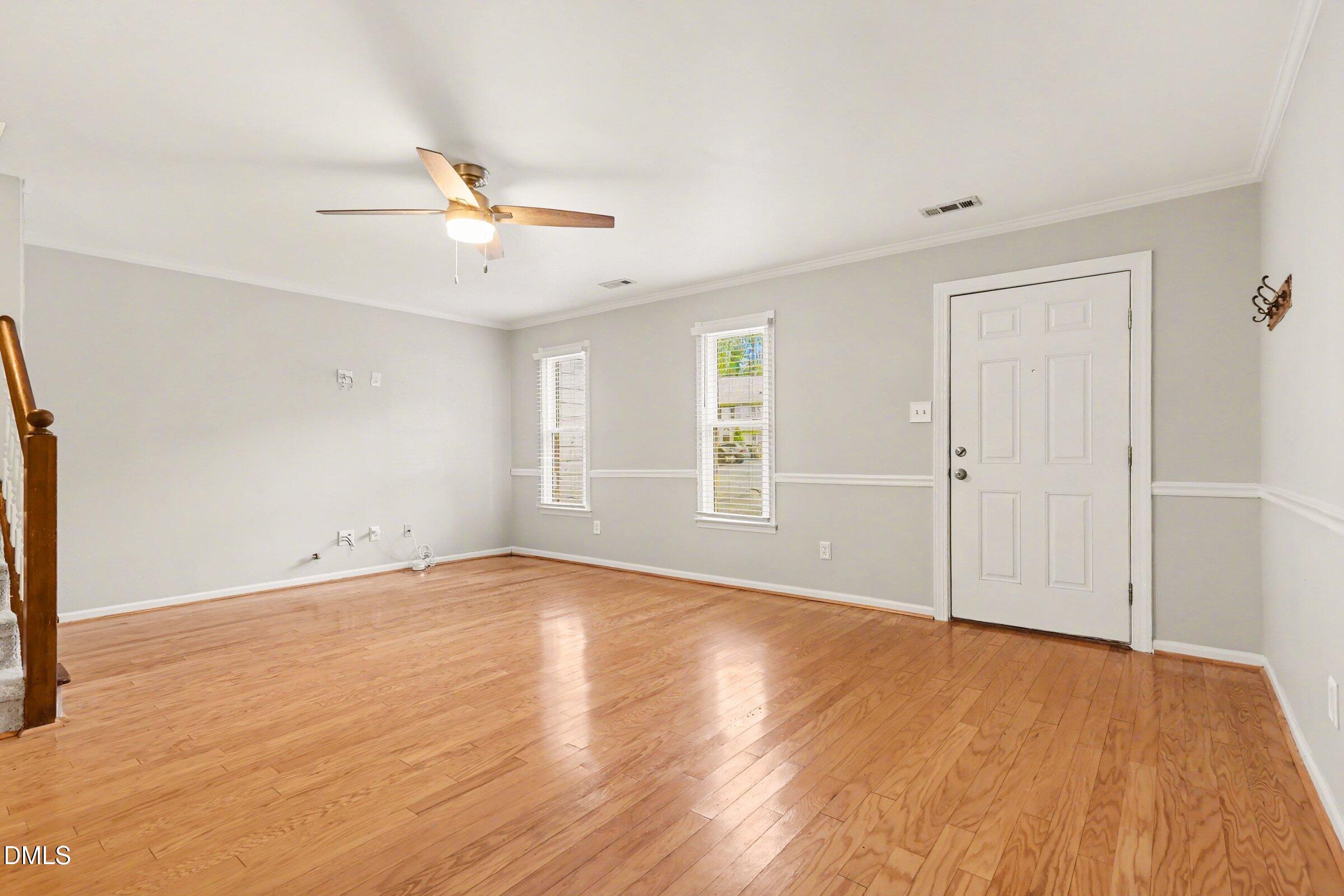 5645 Hamstead Crossing Raleigh, NC 27612 - Photo 7 of 35 wooden floor in an empty room with a window