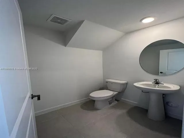 a view of a livingroom with a staircase