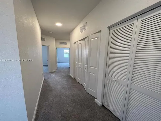 a view of a room with windows