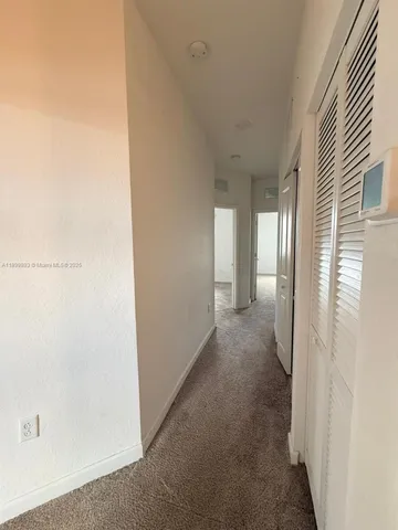 a view of a room with an entryway