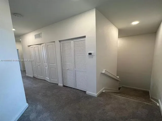 a view of a room with a sink and window
