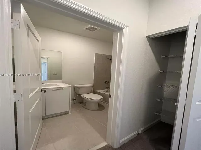 a bathroom with a sink a toilet and a bathtub