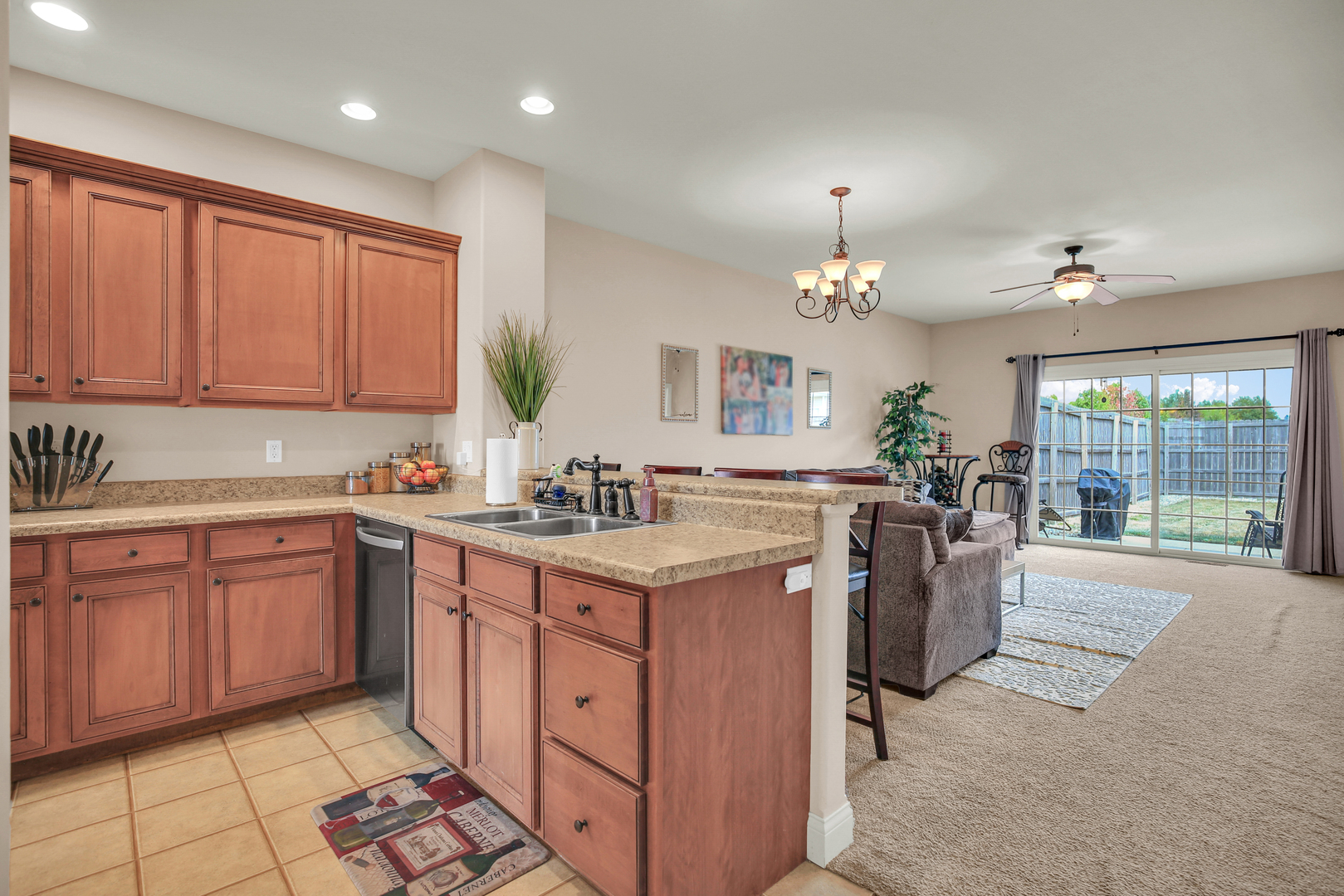 1504 Stonebluff Court, Unit 1504 Champaign, IL 61822 - Photo 13 of 40 a kitchen with granite countertop a sink stove and cabinets