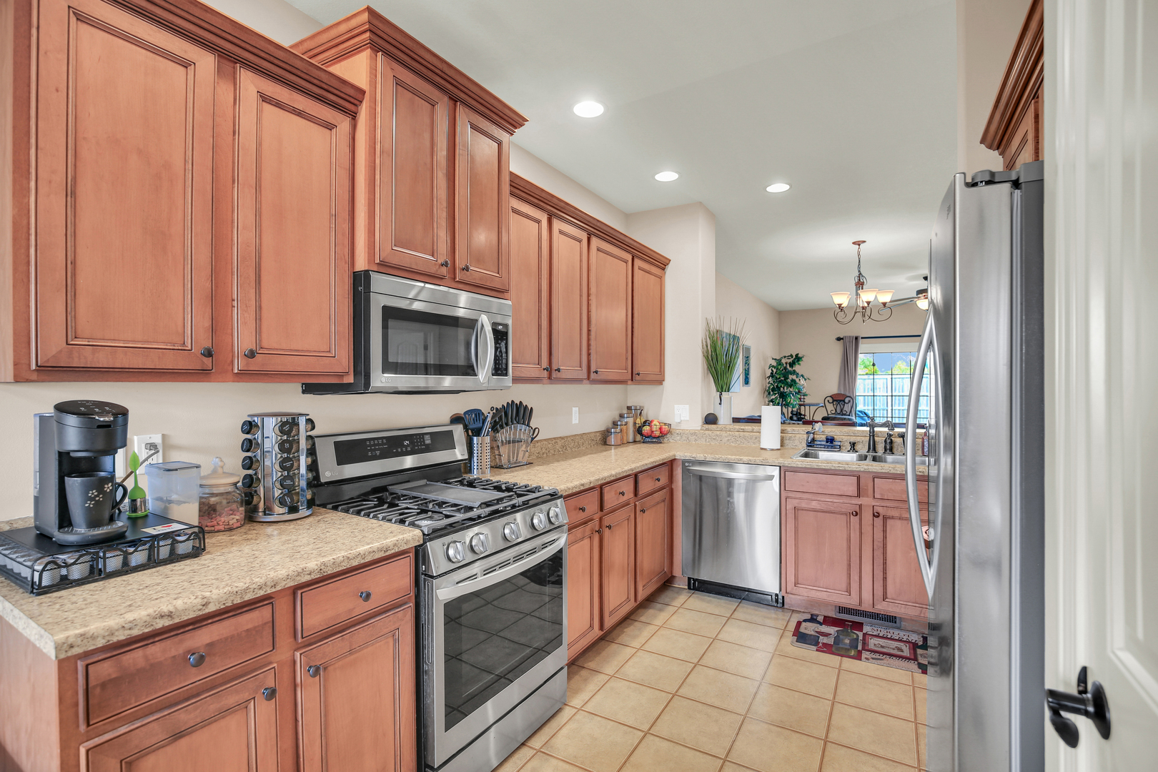 1504 Stonebluff Court, Unit 1504 Champaign, IL 61822 - Photo 17 of 40 a kitchen with a sink stove and cabinets