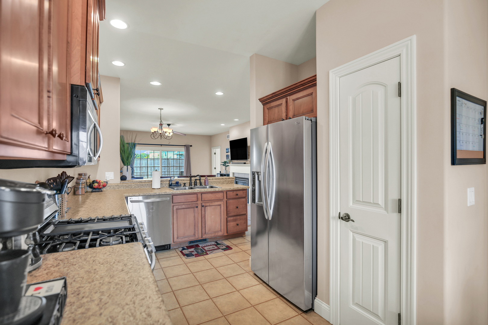 1504 Stonebluff Court, Unit 1504 Champaign, IL 61822 - Photo 18 of 40 a kitchen with refrigerator and cabinets