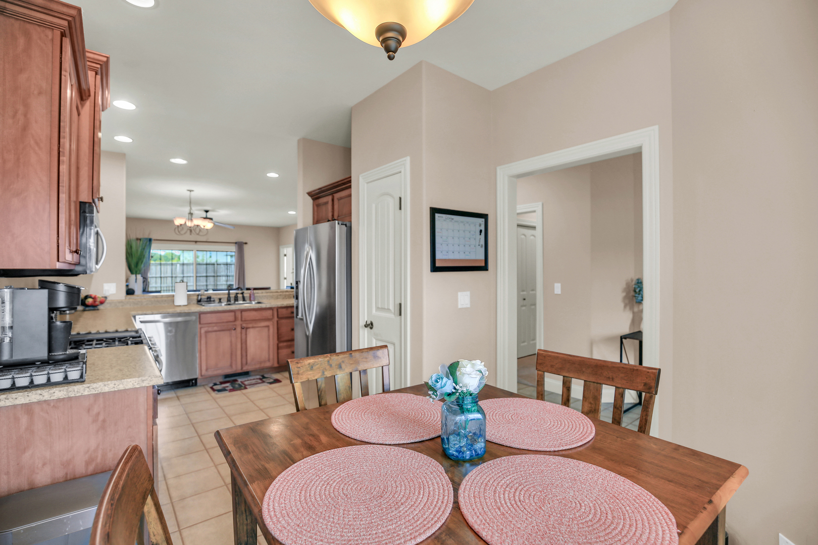 1504 Stonebluff Court, Unit 1504 Champaign, IL 61822 - Photo 20 of 40 a dining room with furniture a table and kitchen view
