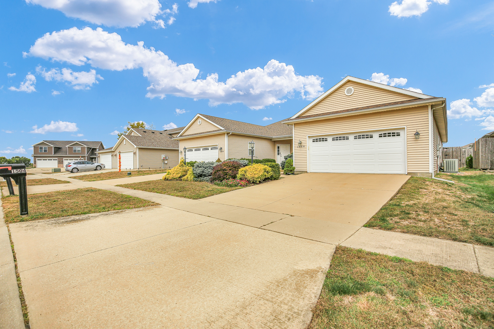 1504 Stonebluff Court, Unit 1504 Champaign, IL 61822 - Photo 2 of 40 a view of a house with basketball court