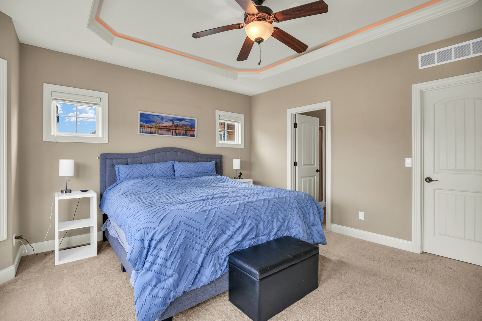 1504 Stonebluff Court, Unit 1504 Champaign, IL 61822 - Photo 22 of 40 a bedroom with a bed and a chandelier