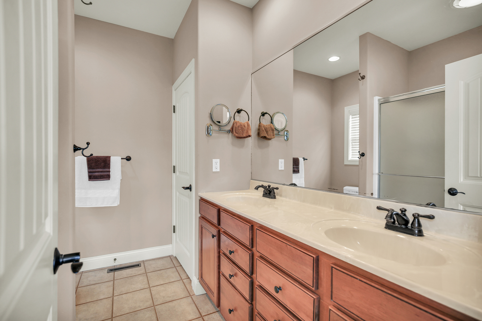 1504 Stonebluff Court, Unit 1504 Champaign, IL 61822 - Photo 24 of 40 a bathroom with a sink vanity and mirror