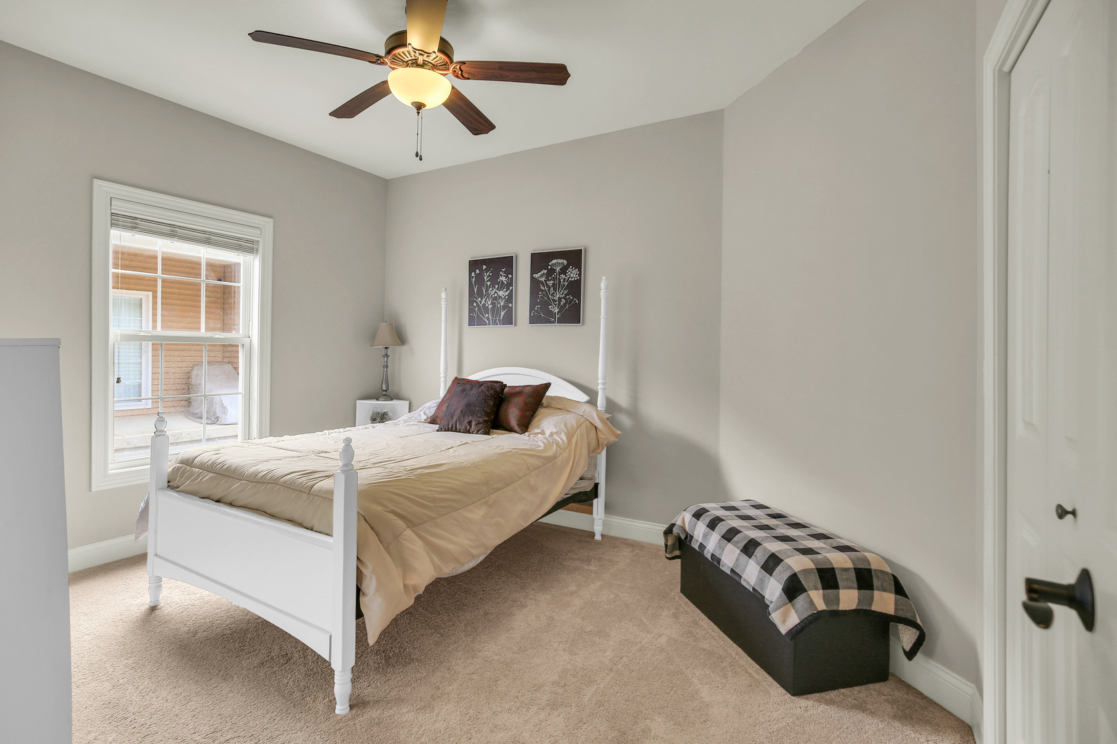 1504 Stonebluff Court, Unit 1504 Champaign, IL 61822 - Photo 27 of 40 a bedroom with a bed and a chandelier