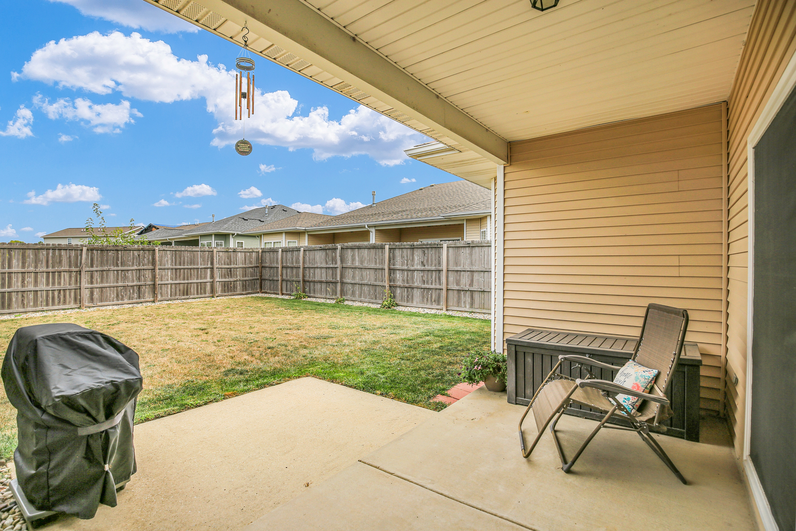 1504 Stonebluff Court, Unit 1504 Champaign, IL 61822 - Photo 34 of 40 a view of a backyard with chair and tables