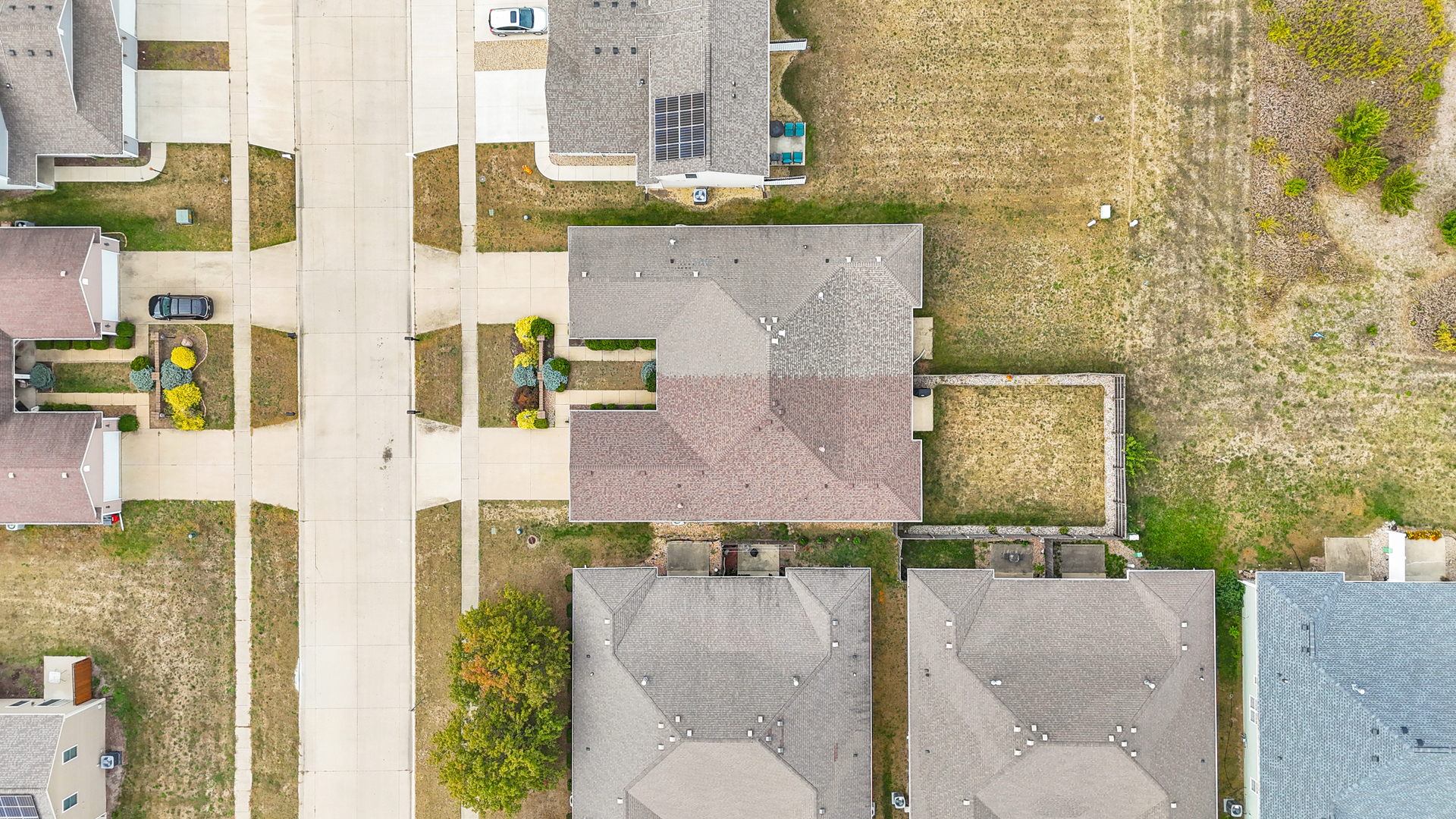 1504 Stonebluff Court, Unit 1504 Champaign, IL 61822 - Photo 39 of 40 aerial view of a brick house with large windows