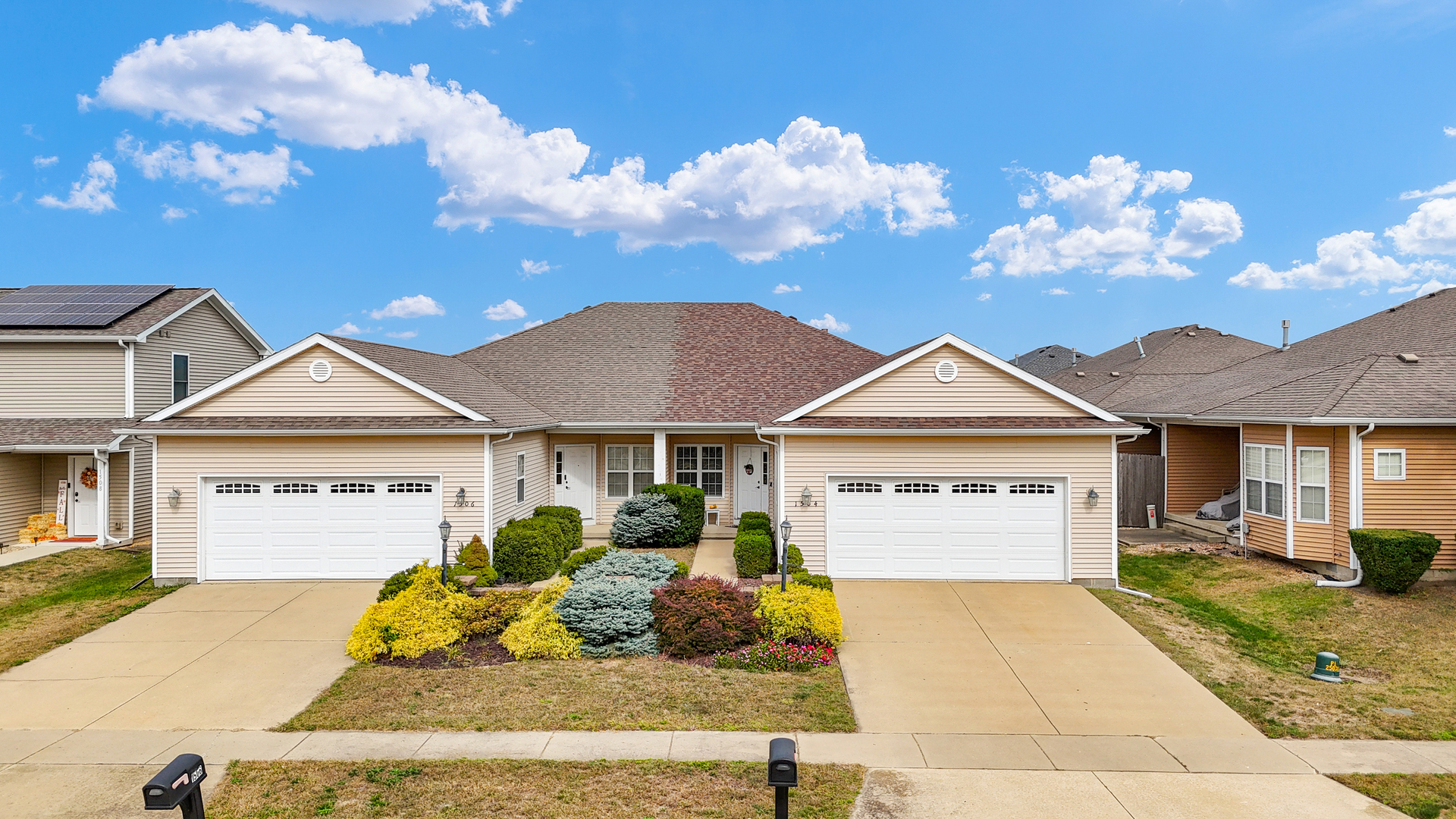 1504 Stonebluff Court, Unit 1504 Champaign, IL 61822 - Photo 5 of 40 a front view of a house with a yard