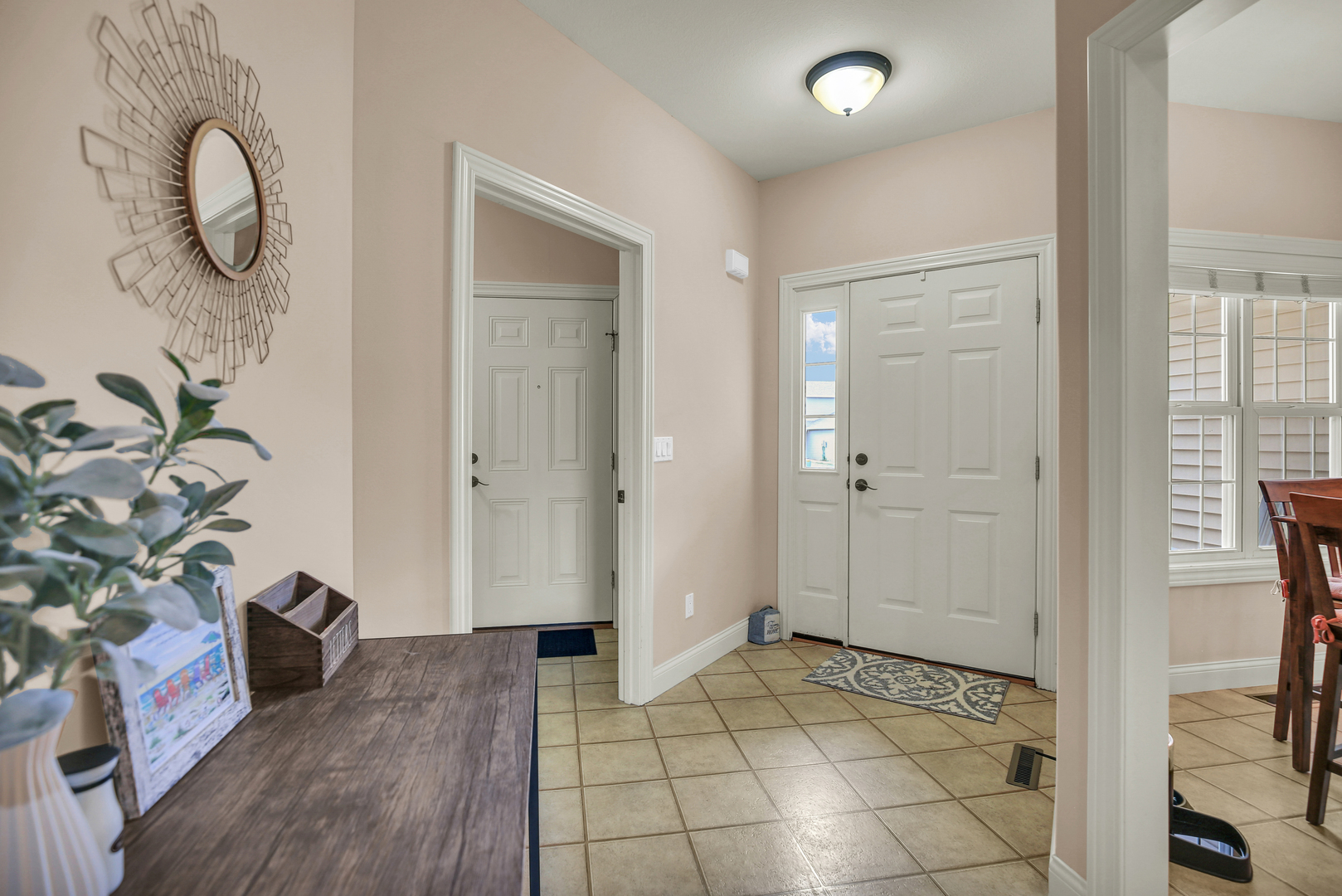1504 Stonebluff Court, Unit 1504 Champaign, IL 61822 - Photo 7 of 40 a view of a livingroom with wooden floor and a chandelier
