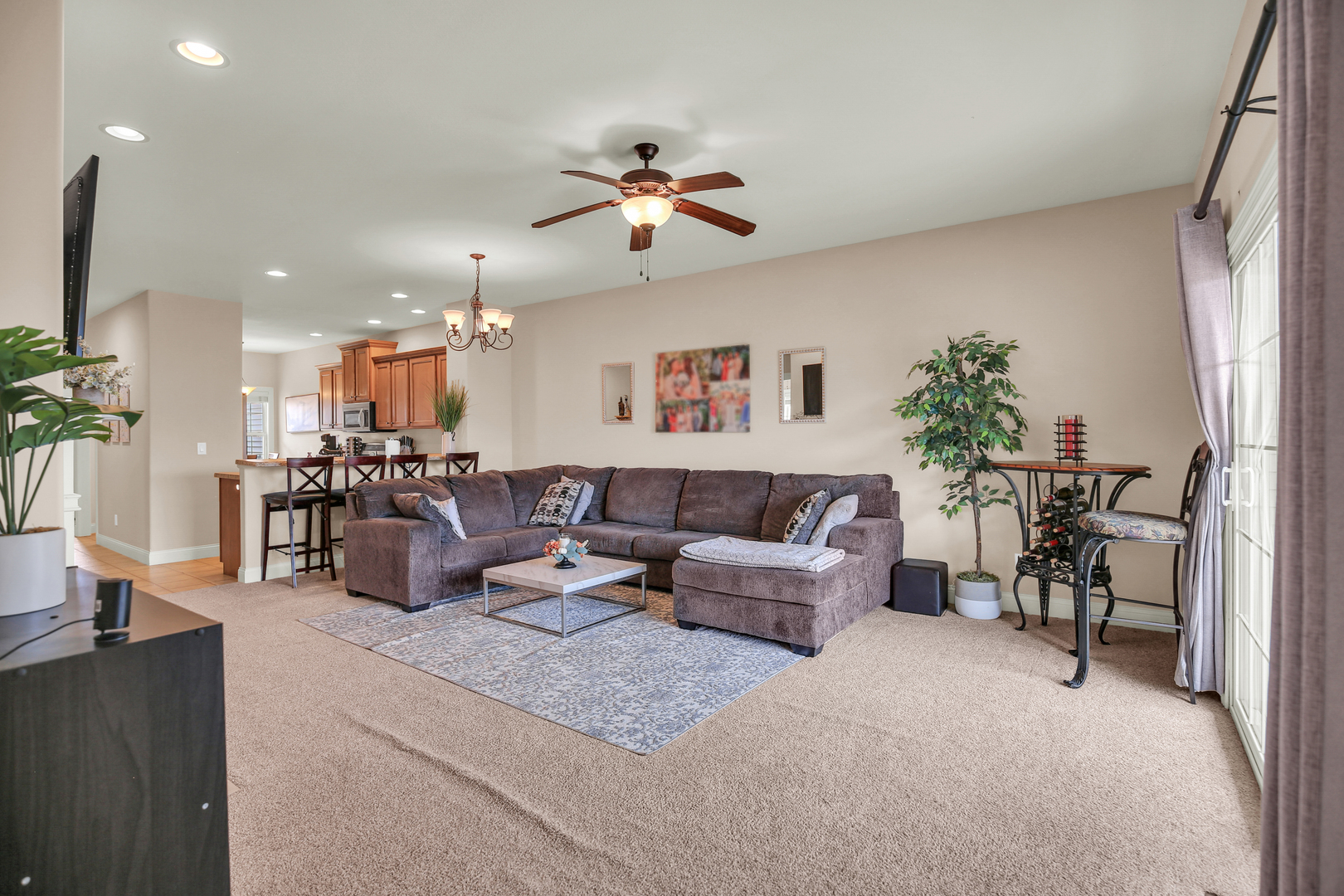 1504 Stonebluff Court, Unit 1504 Champaign, IL 61822 - Photo 9 of 40 a living room with furniture and a flat screen tv