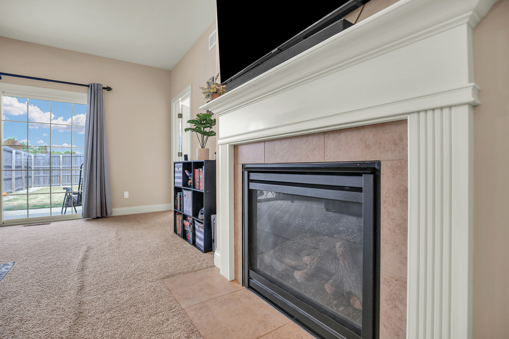 1504 Stonebluff Court, Unit 1504 Champaign, IL 61822 - Photo 10 of 40 a view of empty room with floor to ceiling window and fire place