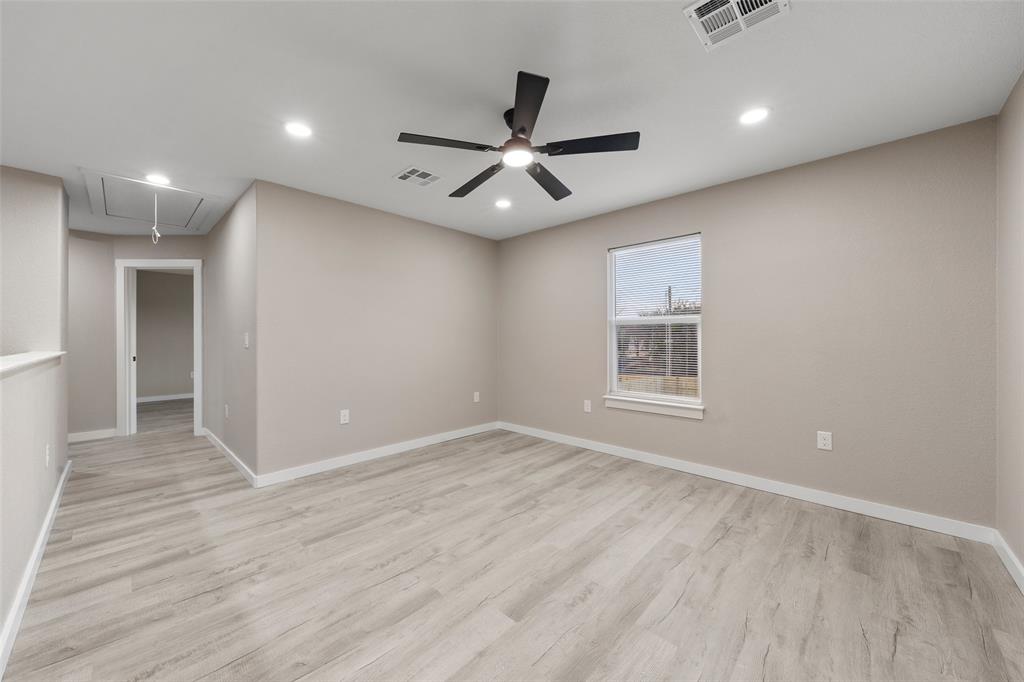 1905 Sanger Avenue Waco, TX 76707 - Photo 12 of 21 wooden floor in an empty room with a window