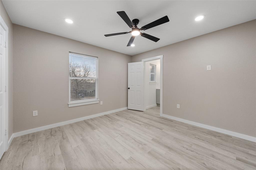 1905 Sanger Avenue Waco, TX 76707 - Photo 13 of 21 an empty room with wooden floor and windows